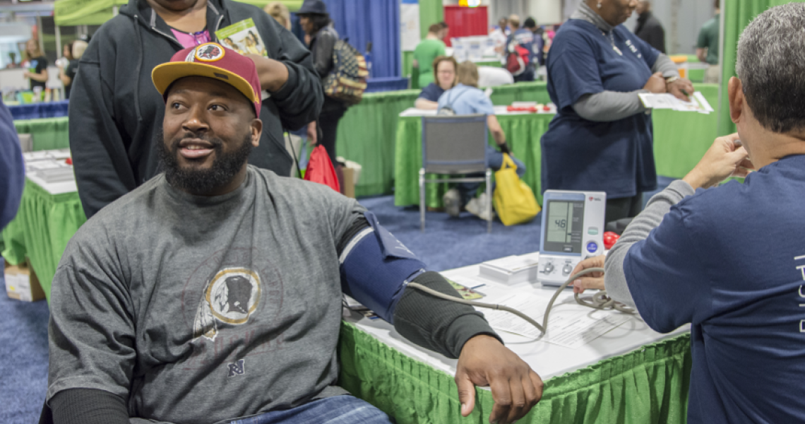 renin Jones getting his blood pressure taken at the GW Ron and Joy Kidney Center Transplant Institute booth at the NBC4 Health and Fitness Expo on January 19, 2015